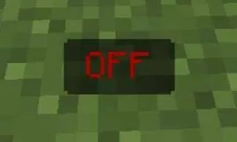 Red OFF button on grass block.