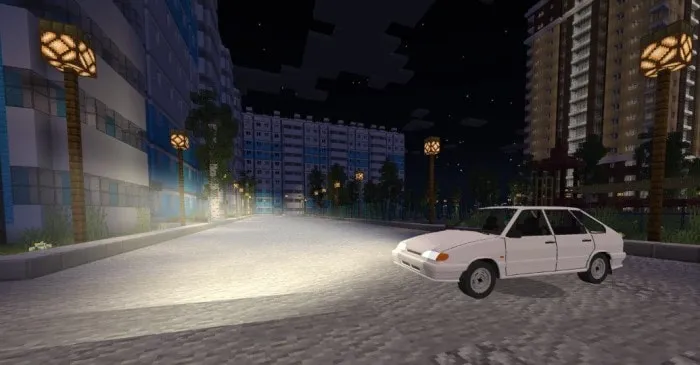 White VAZ-2114 car on a city street at night