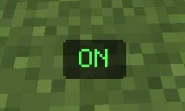 Green ON button displayed on a grassy block.