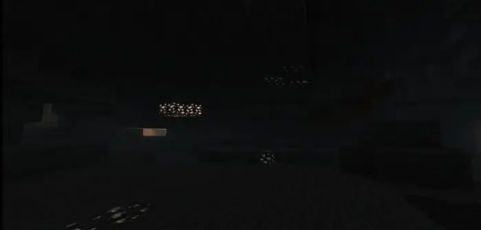 Dimly lit cave with glowing stone blocks