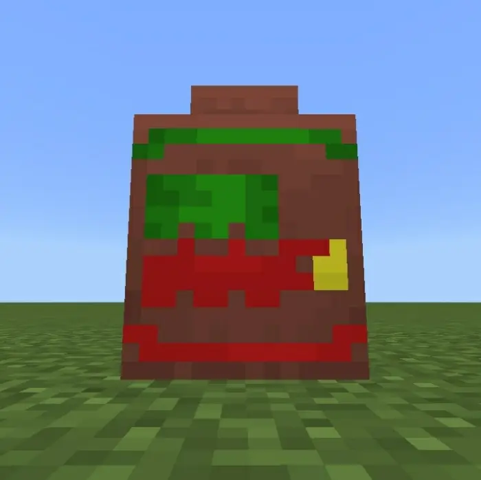 Colorful pixelated decorative pot on grass