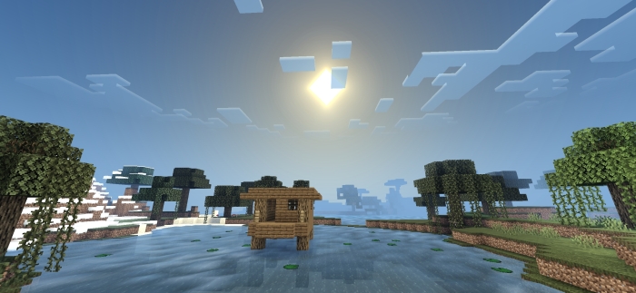 Sunlit cabin by a shimmering icy lake