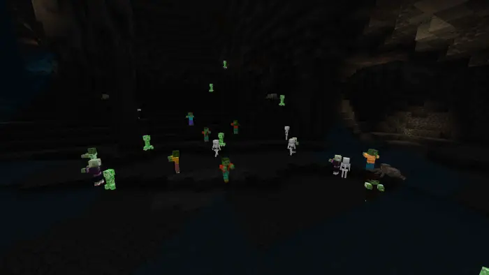 Glowing mobs visible in a dark cave.