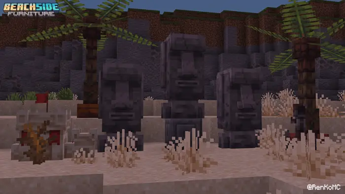 Stone tiki statues and palm trees on sand