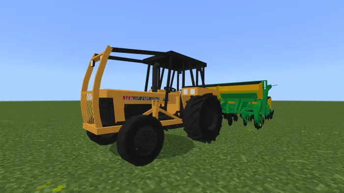 Blocky yellow tractor with green farm implement