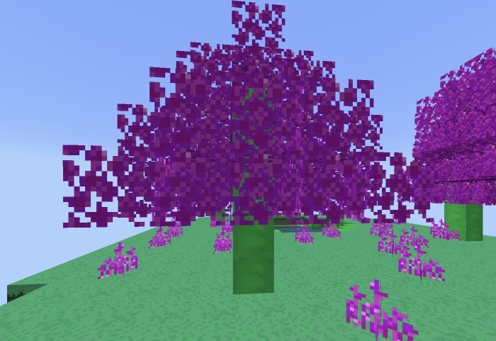 Blocky purple trees with green trunks on grass