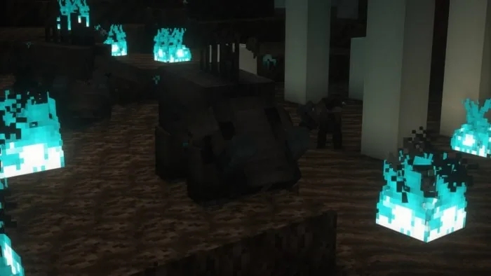 Dark hoglins near glowing blue flames