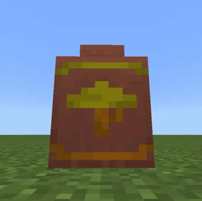 Colorful pixelated decorative pot on grass