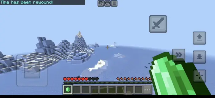 Player holding green orb in icy landscape