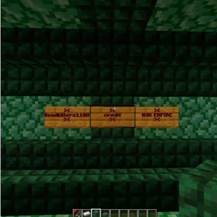 Credit signs on green block wall in lobby
