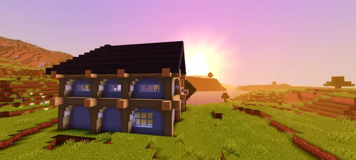 Two-story starter house on grassy plains.