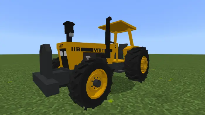Blocky yellow tractor on grassy terrain