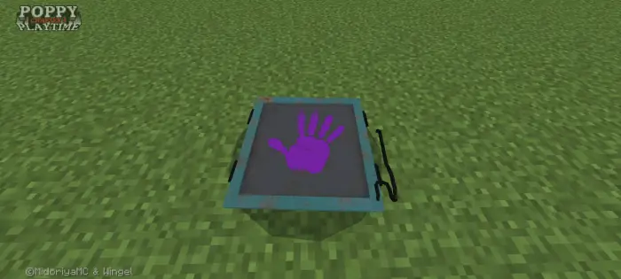 Purple handprint panel on grassy ground