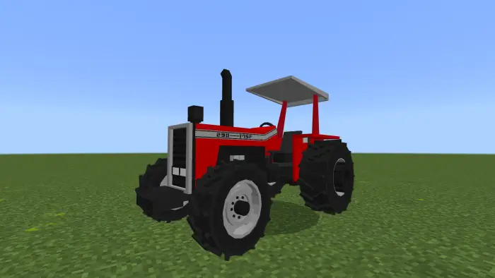 Blocky red tractor on grassy field