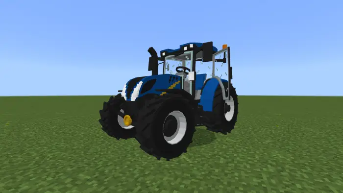 Blocky blue tractor on grassy field