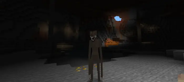 Terrifying creature stands in dark cave.
