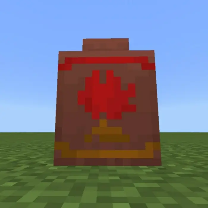 Colorful pixelated decorative pot on grass