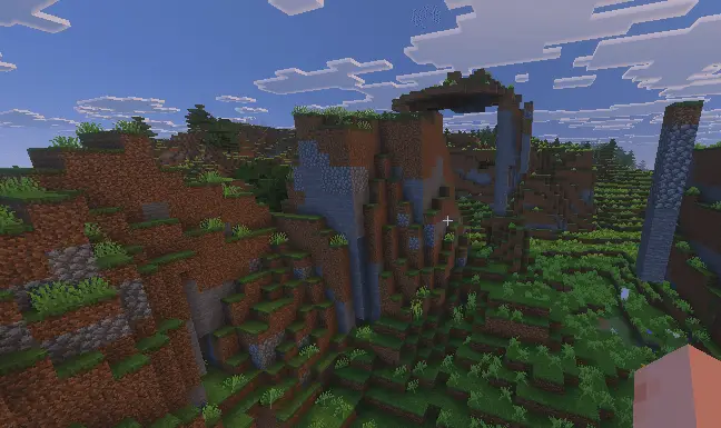 Overhauled grassy hills and rocky cliffs