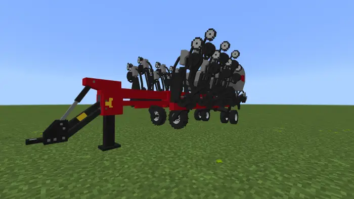 Red pixelated farming implement on grass.