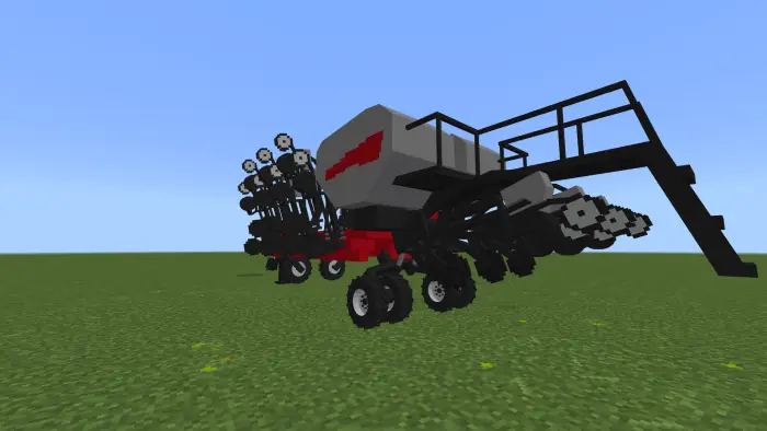 Pixelated seeder machine on grass field