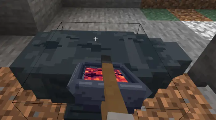 Player uses tongs at a heated forge.