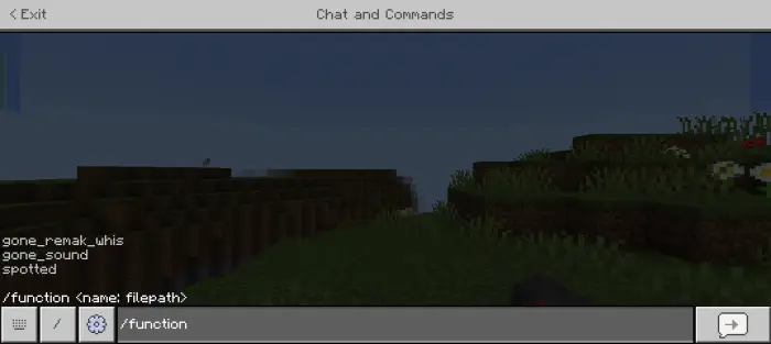 Game chat shows command input and grassy hills.