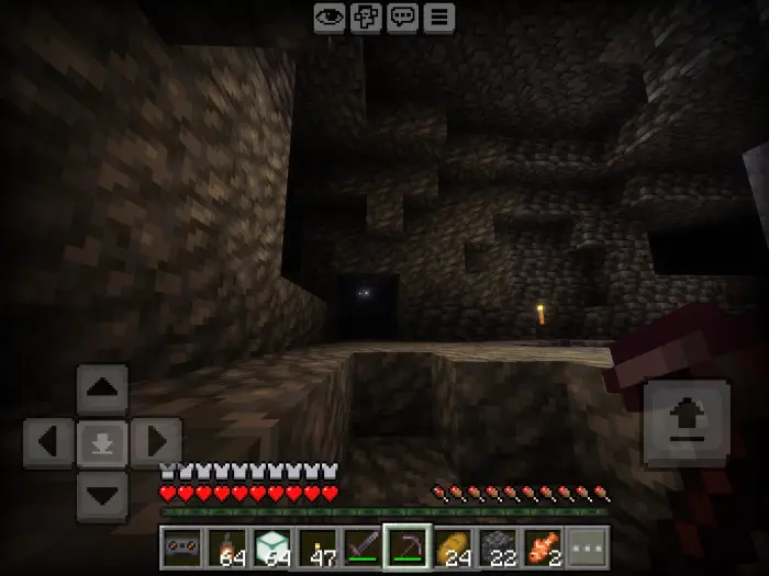 Dark cave with glowing eyes and torchlight.