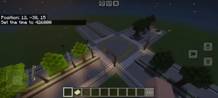City intersection with trees and streetlights