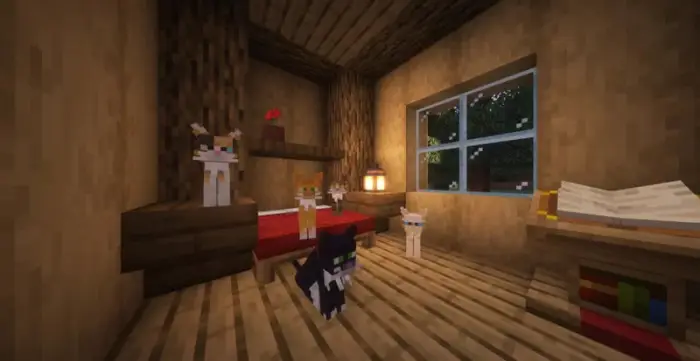 Five stylized cats inside a cozy wooden room