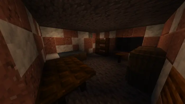 Dimly lit, blocky room with furniture.