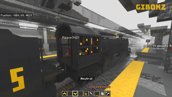Blocky train engine at a station platform