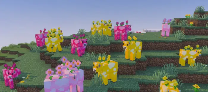 Colorful flower cows on grassy hillside