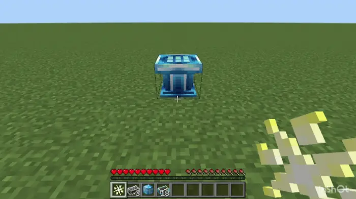 Blue futuristic block on grassy plain