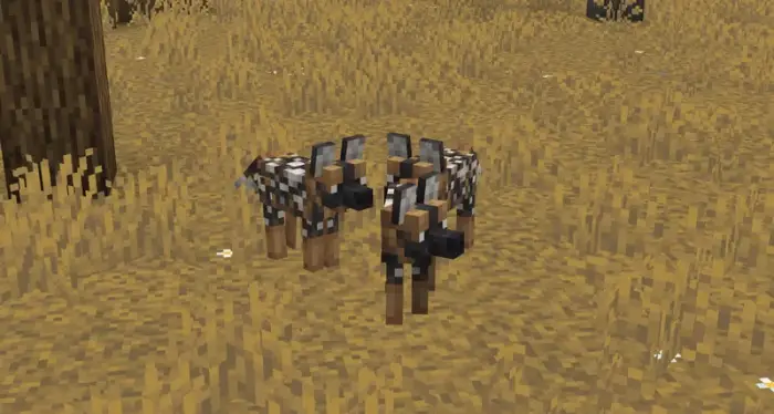 Stylized wolves in a grassy field