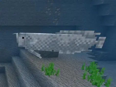 Pixelated white fish swims in underwater biome.