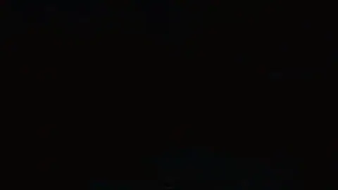 Image too dark to discern any furniture.