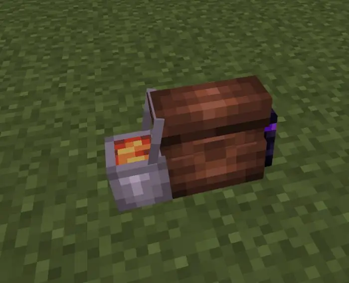 Brown blocky backpack with item on grass.