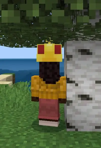 Character wears a cake-themed hat outdoors