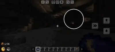 Player explores a dark cave with night vision
