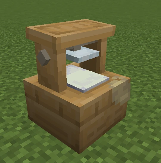Wooden press with paper on grassy ground