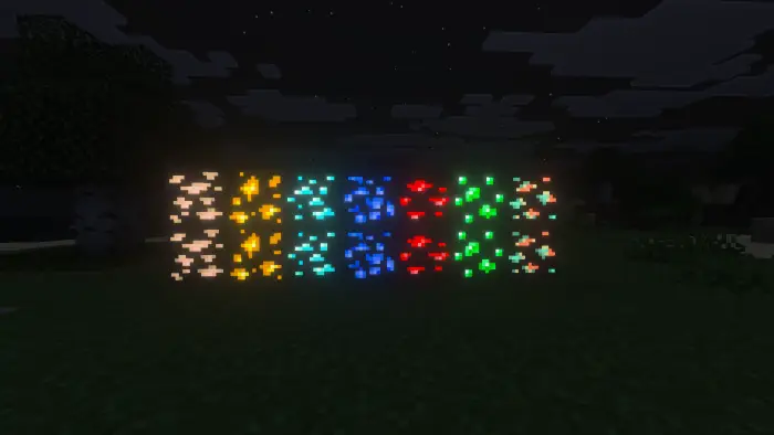Glowing colored ore blocks in a dark cave