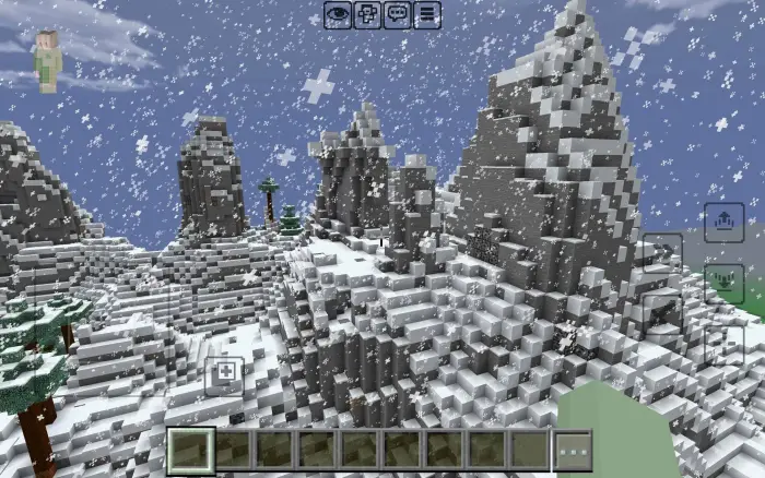 Light snow falls over blocky mountain peaks.