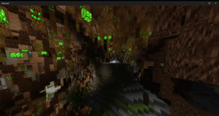 Underground cavern with glowing green crystals