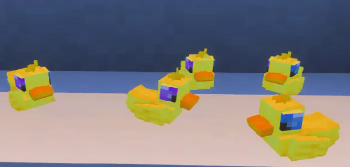 Pixelated yellow rubber ducks on display.