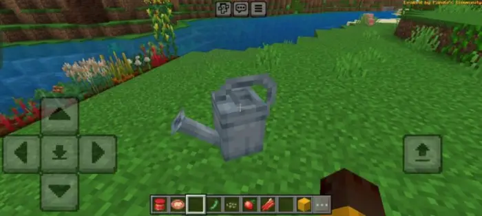 Watering can placed on grassy terrain