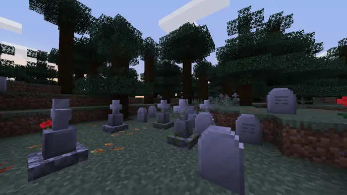 Gravestones and autumn leaves in a forest
