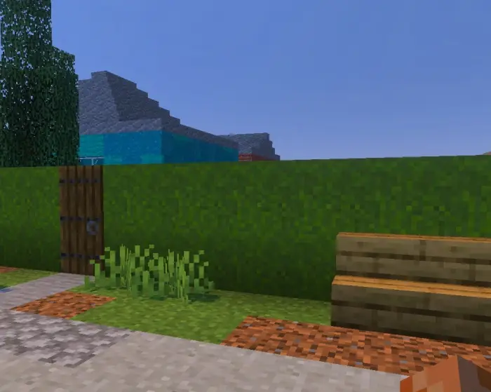 Blocky countryside path with bench and gate