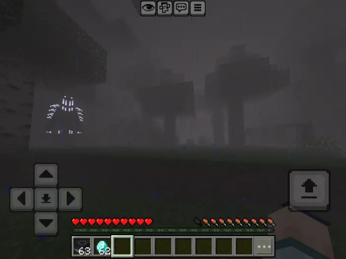 Foggy forest with glowing entity at night.