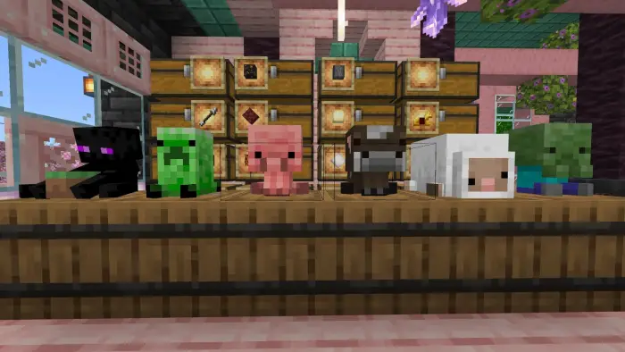 Five animal plushies on a wooden table.