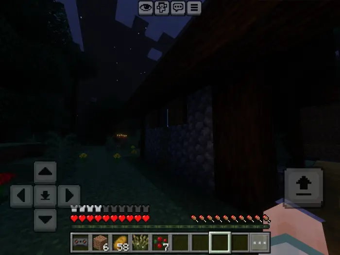 Player exploring a dark, spooky night scene